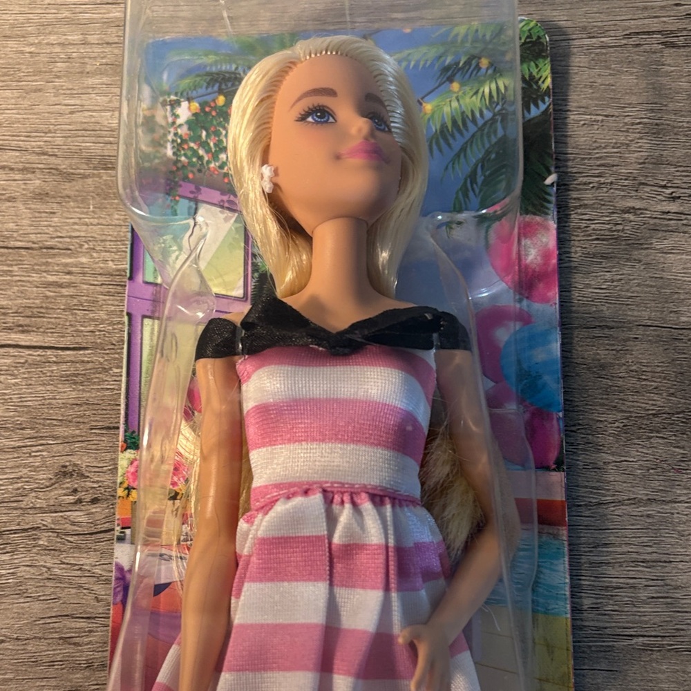 Barbie Mattel Doll with Pink and White Striped Dress
65 year addition